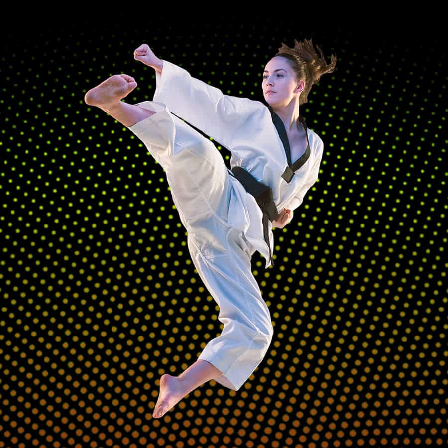 Martial Arts Lessons for Adults in Frisco TX - Girl Black Belt Jumping High Kick